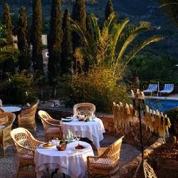 An outdoor restaurant in hotel Belmond La Residencia, Deia